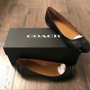 Black COACH flats in 7.5M